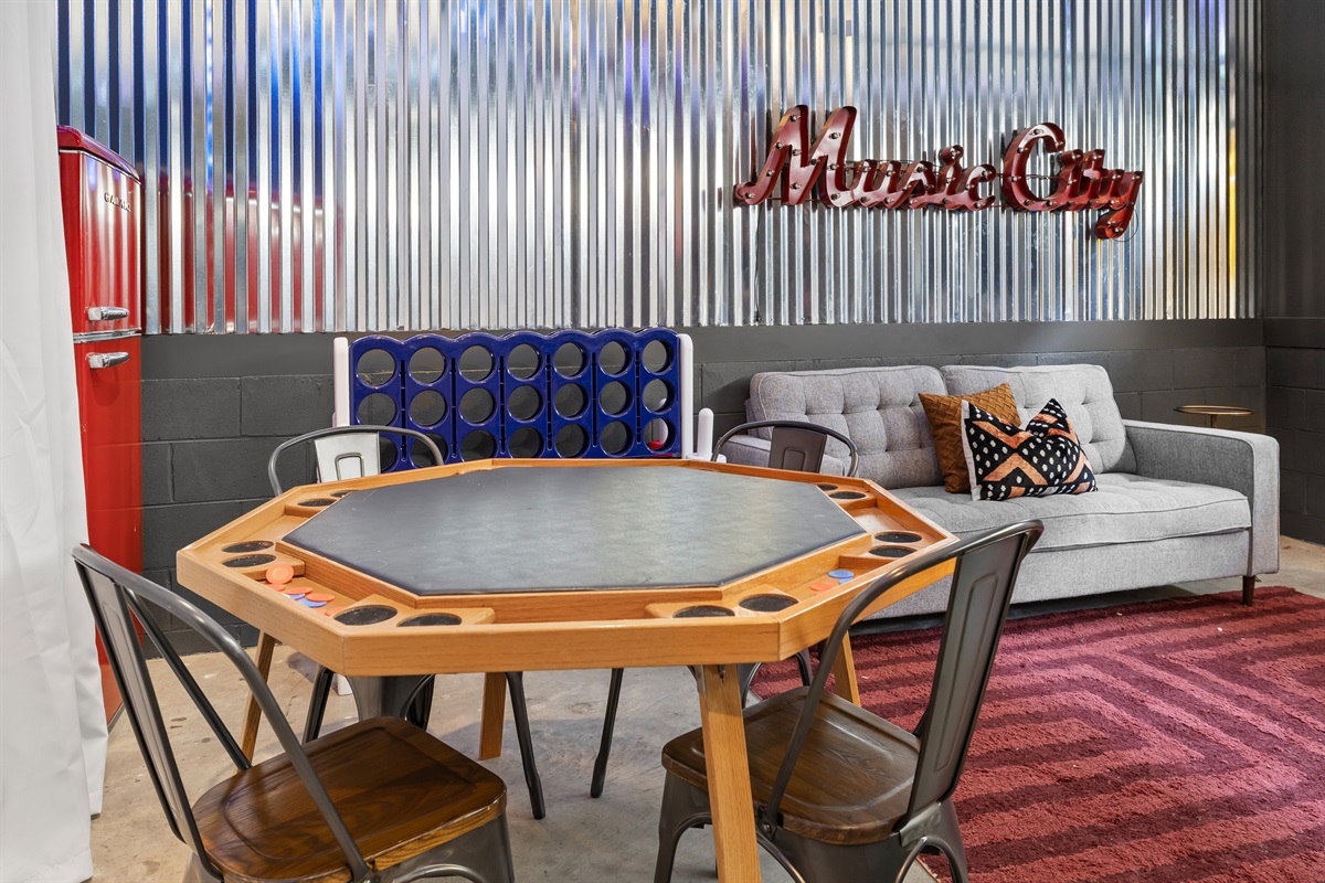 Game Room: Gather around the hex table for fun and laughter in vibrant Music City style!