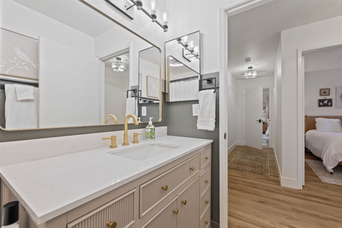 Upstairs community bathroom with tub/shower combo.