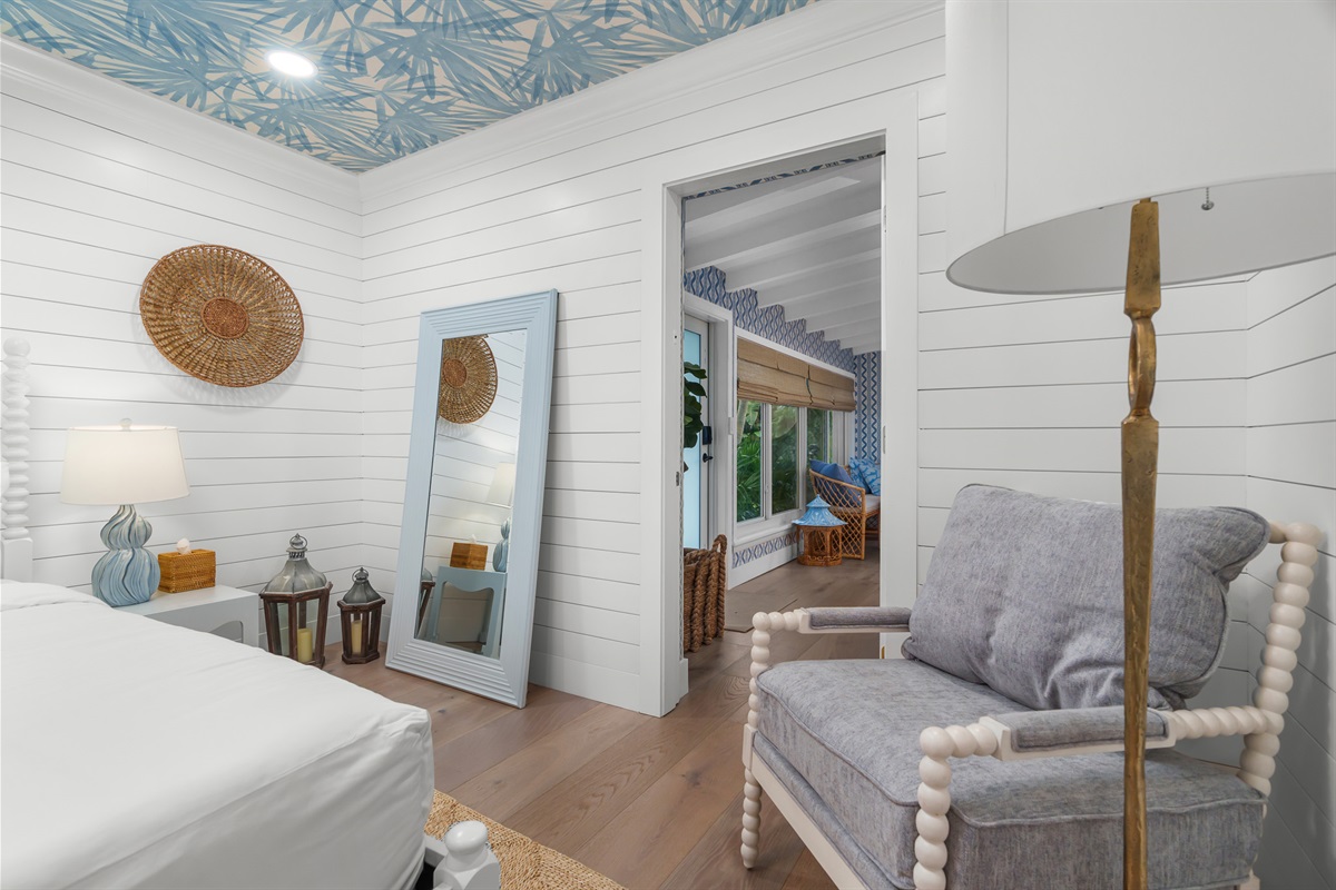 Your private reading nook. This space combines rustic shiplap walls with high-end furnishings for ultimate relaxation.