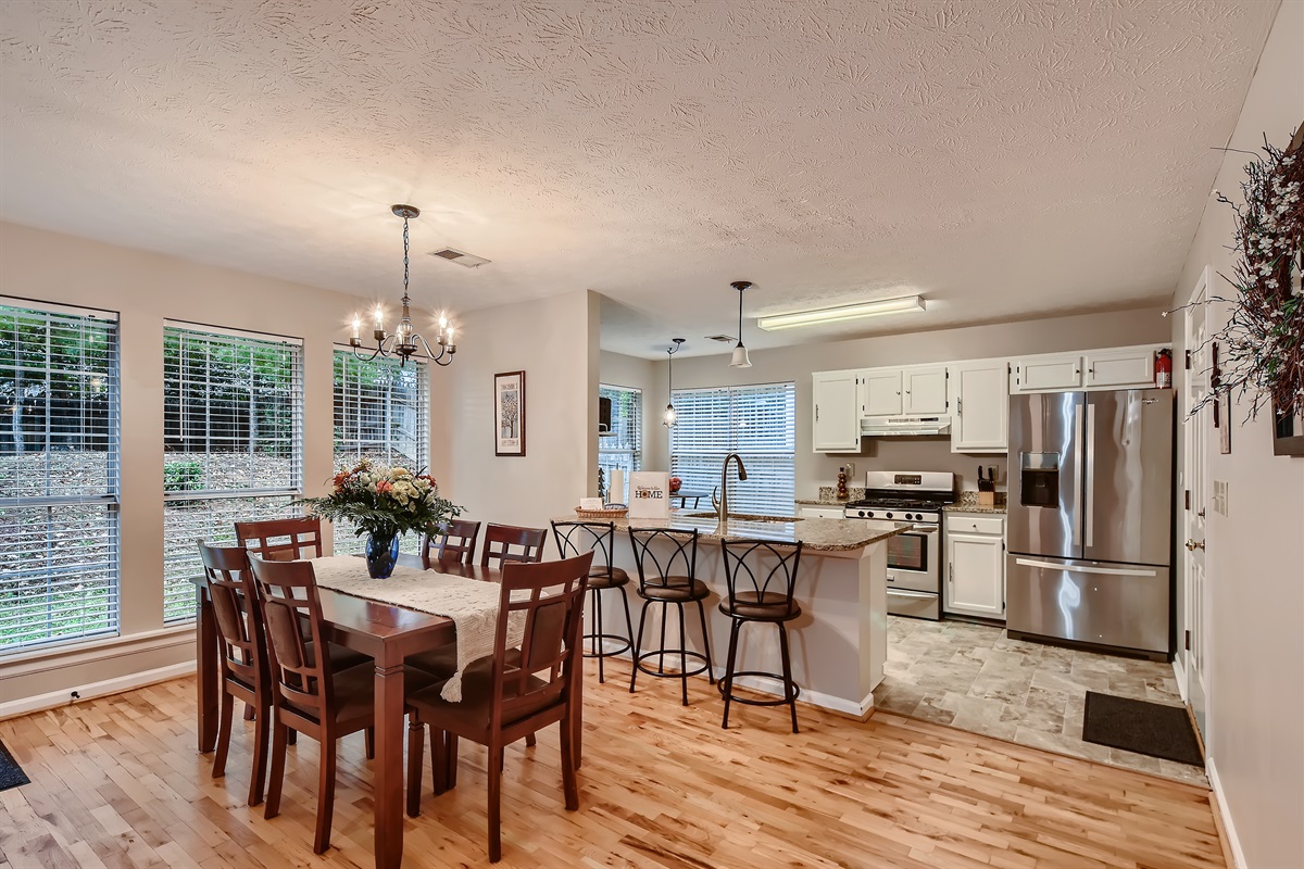 Plenty of seating at the dining table and bar.