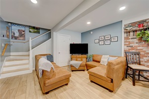 Living room with couches and a tv