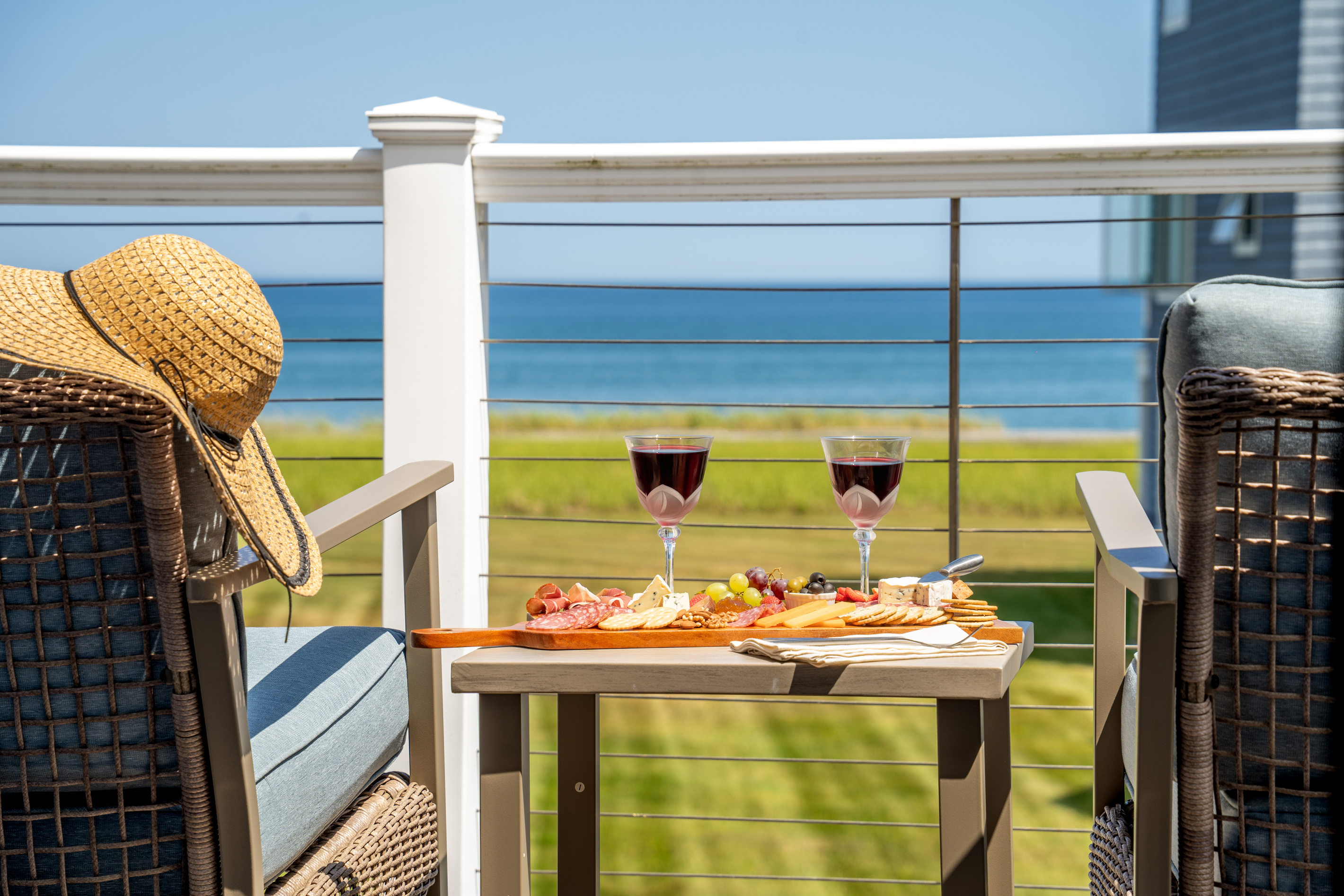 Ocean views with a side of wine and snacks—the perfect setting for an afternoon on the deck.