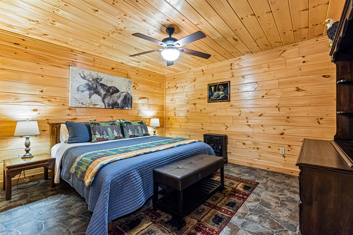 Moose Majesty: This cabin bedroom is adorned with stunning wildlife art, creating a peaceful atmosphere.