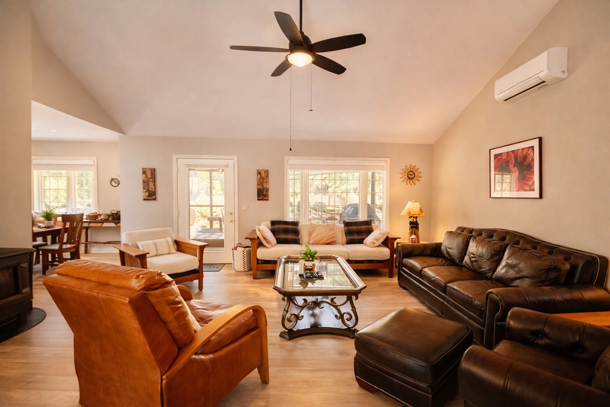 Embrace the cozy charm of our living room with a crackling fireplace, nestled in our inviting open floor plan. Perfect for gathering, relaxing, and making memories