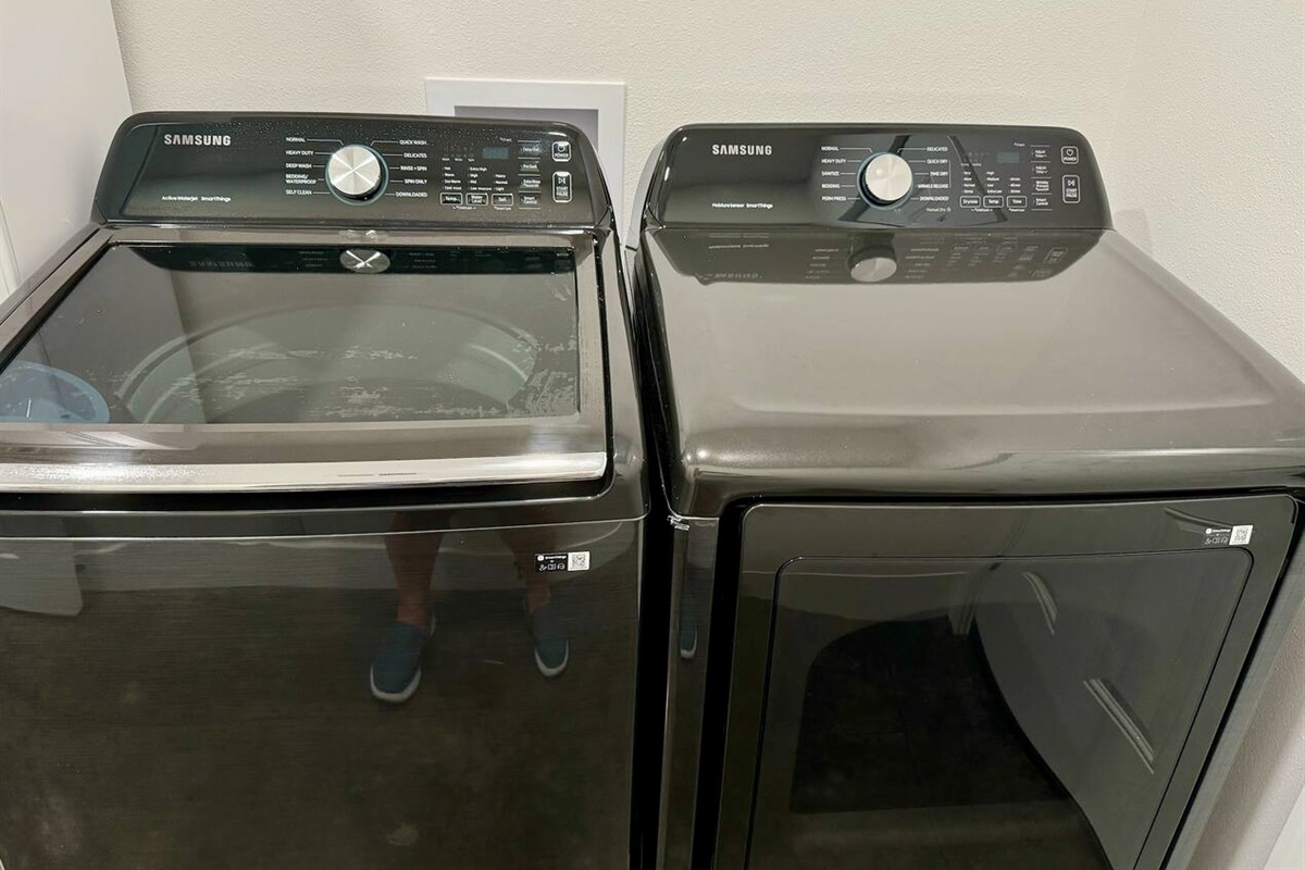 Brand new washer and dryer. We provide laundry soap, dryer sheets, cleaning products, a mop, a vacuum, a first aid kit, and more in this dedicated space.