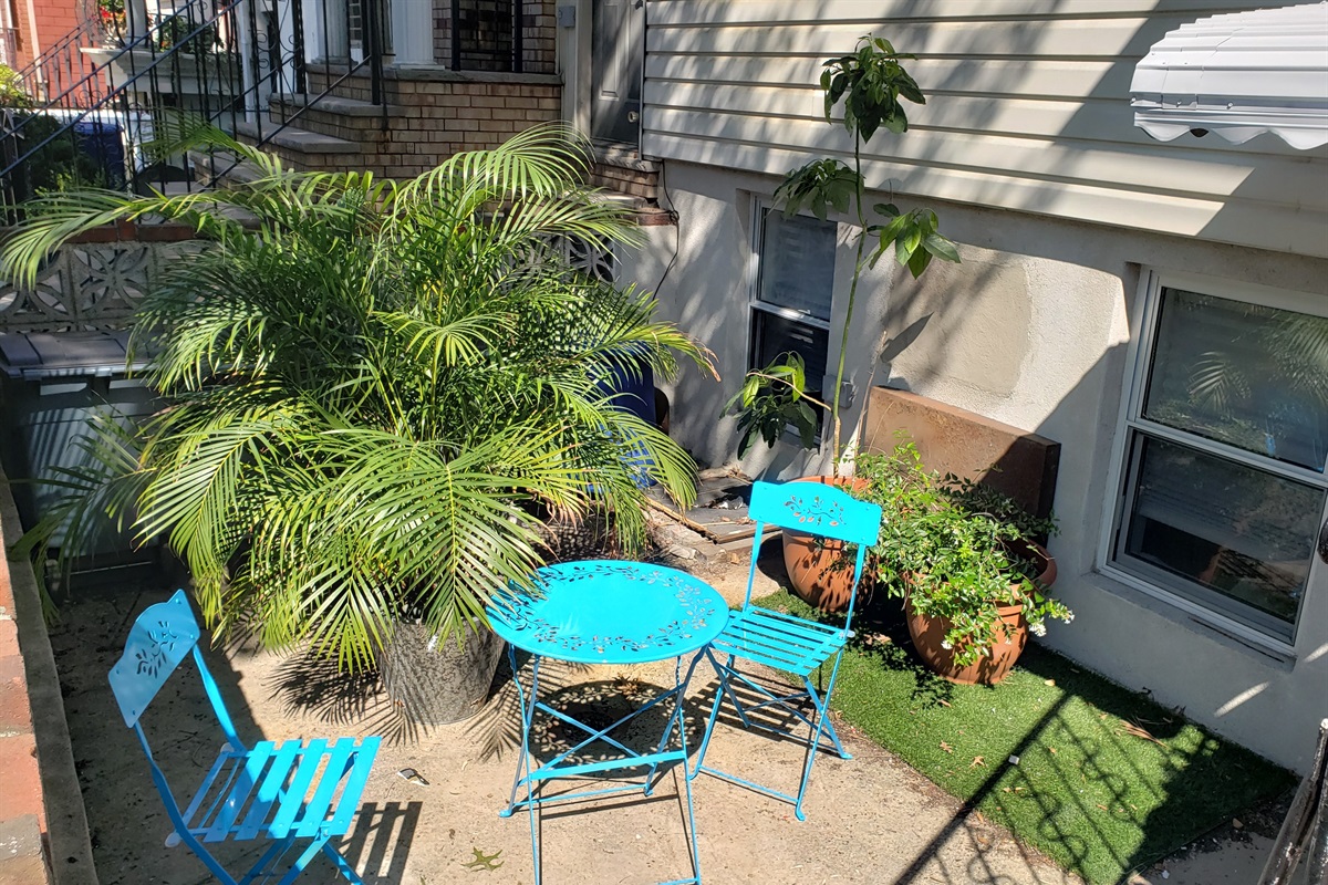 Step outside to this charming patio where café style seating and greenery invite you to linger in the fresh air.