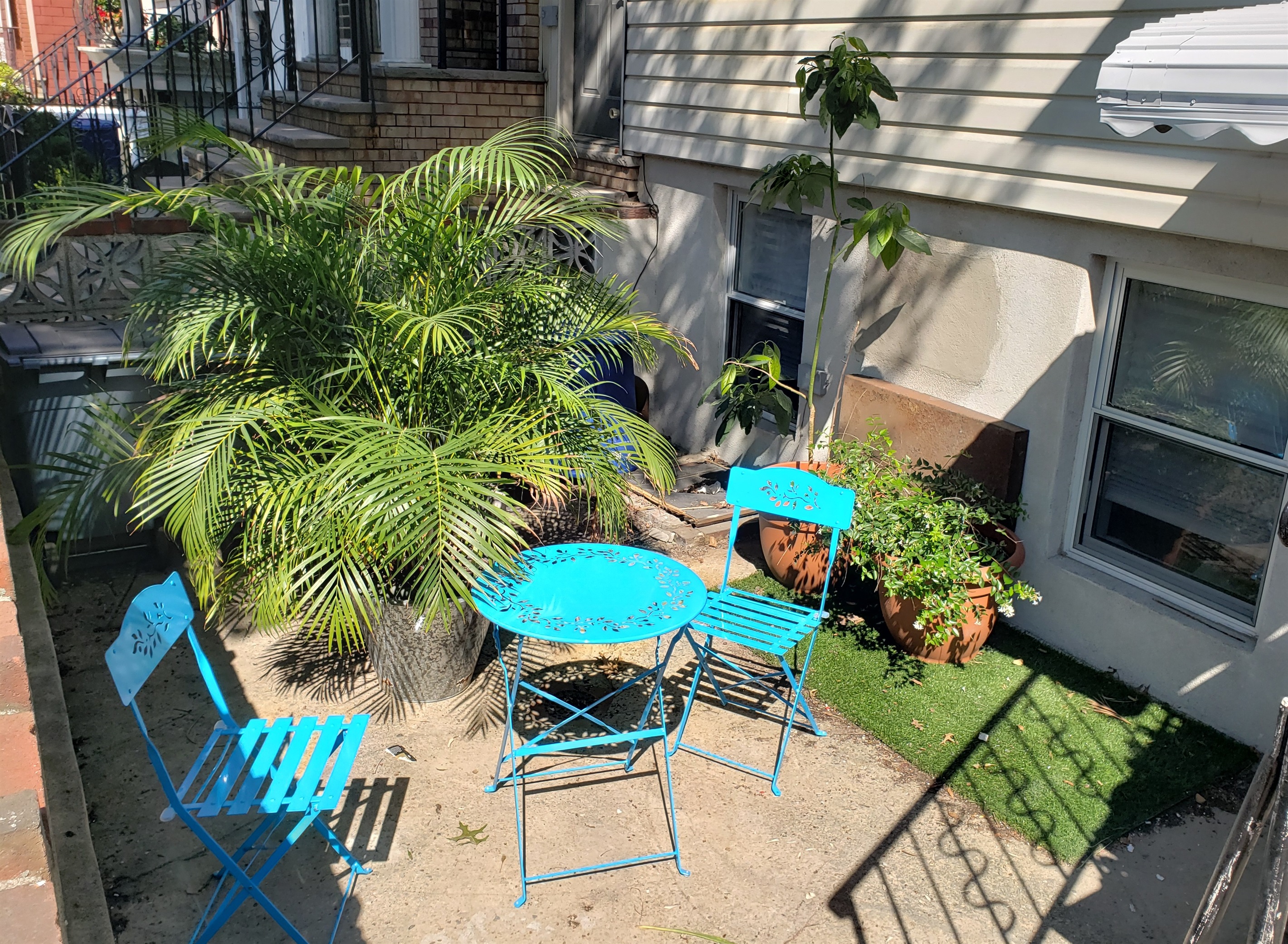 Step outside to this charming patio where café style seating and greenery invite you to linger in the fresh air.