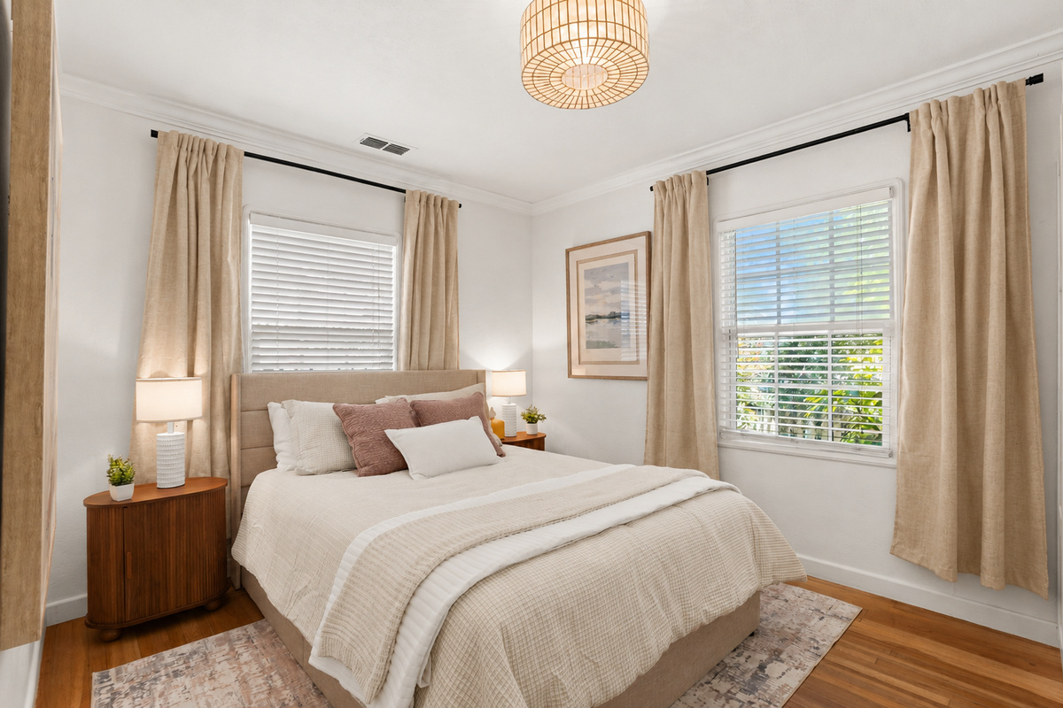 Bedroom 1 features a comfortable queen bed, soft linens, calming decor, and a relaxing space to unwind and recharge.