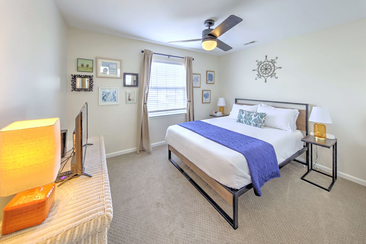 Fresh linens provided and beds professionally made before arrival—no linen rentals required.

Bedroom 3: Tranquil retreat with modern decor, a comfy queen bed, and sunny coastal vibes!