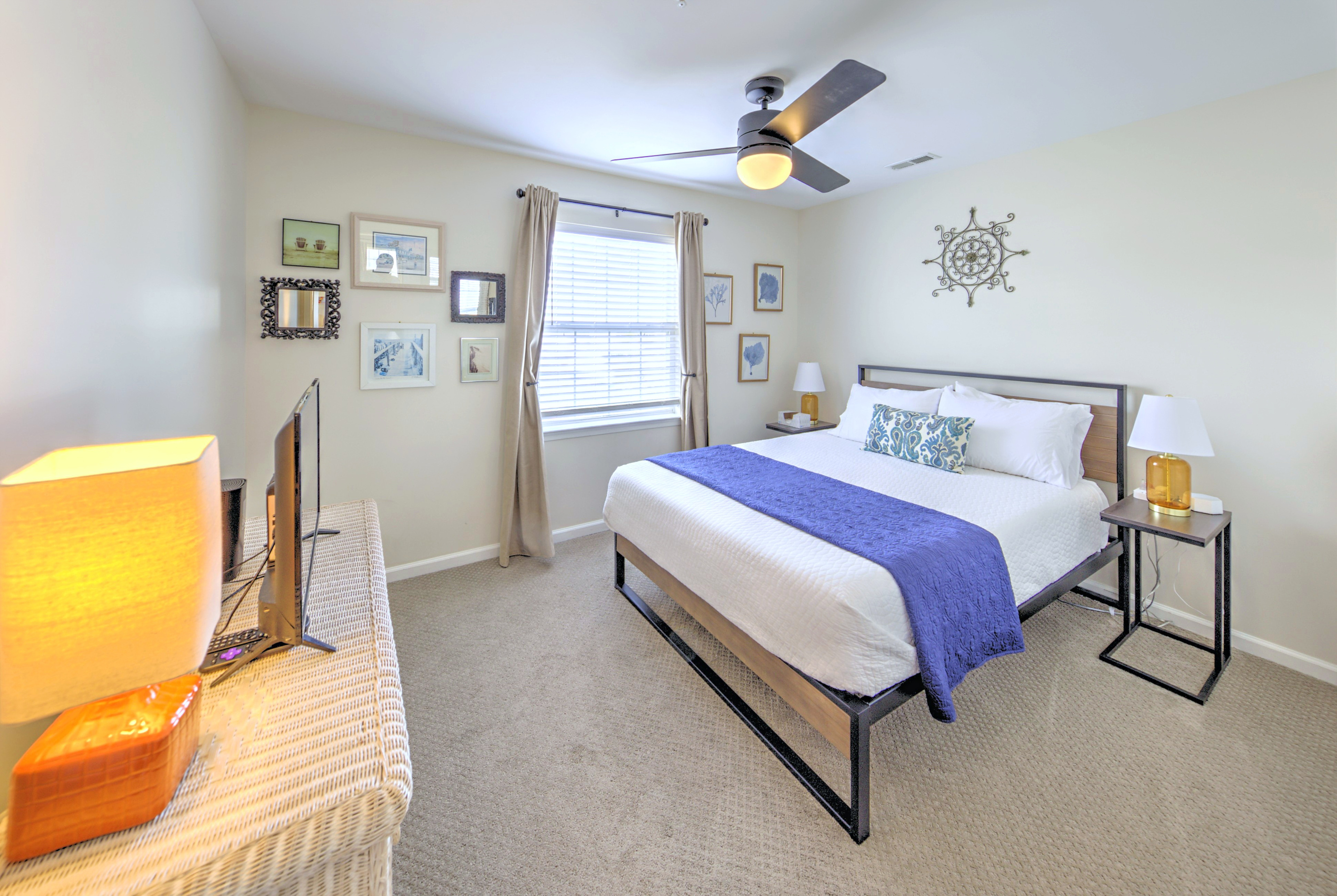 Fresh linens provided and beds professionally made before arrival—no linen rentals required.

Bedroom 3: Tranquil retreat with modern decor, a comfy queen bed, and sunny coastal vibes!