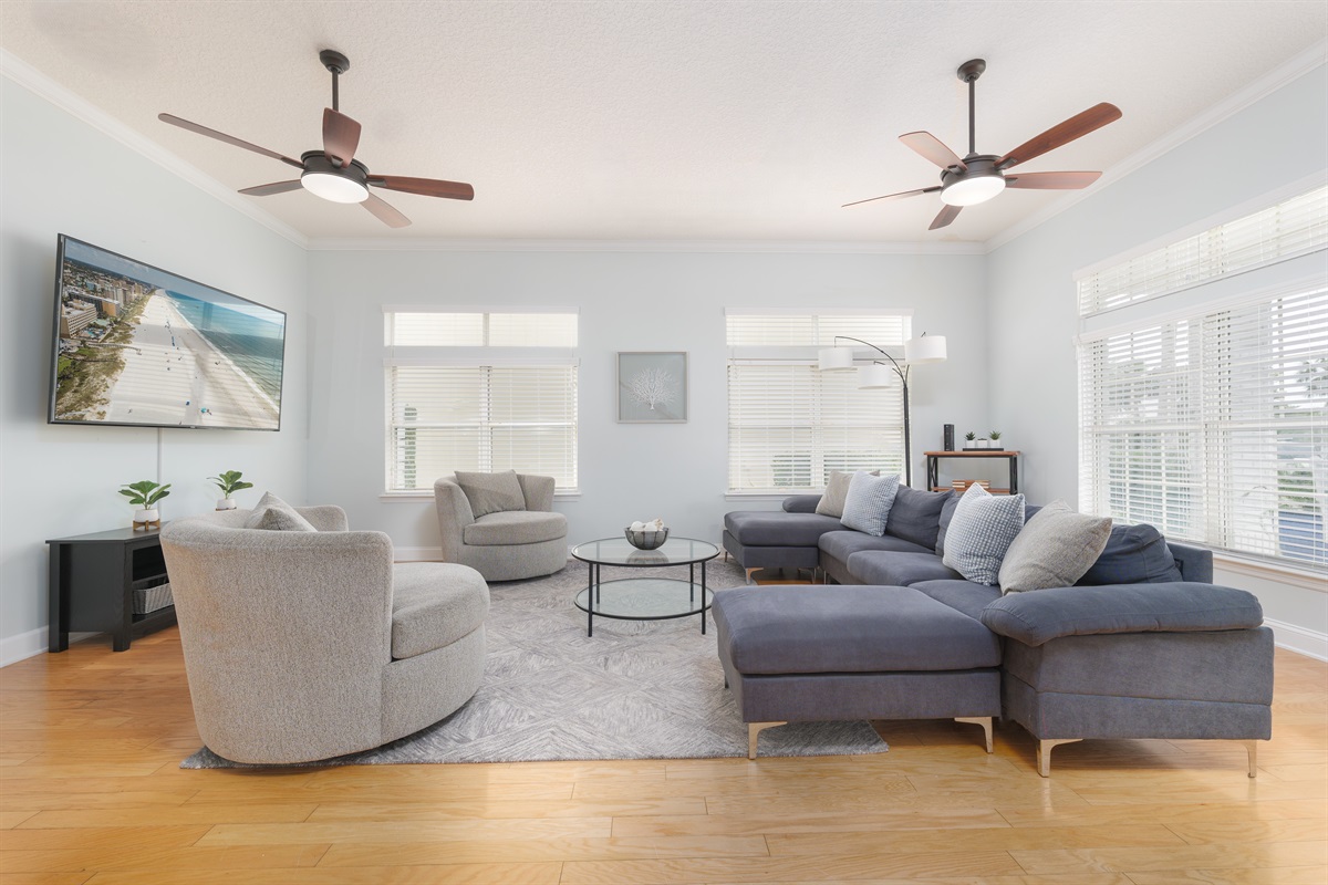 Bright, open and welcoming - this spacious living room is perfect for movie nights, lazy mornings, or gathering with friends and family