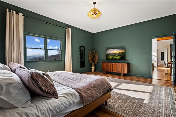 Another look at the primary bedroom, where space, light, and mountain views come together.