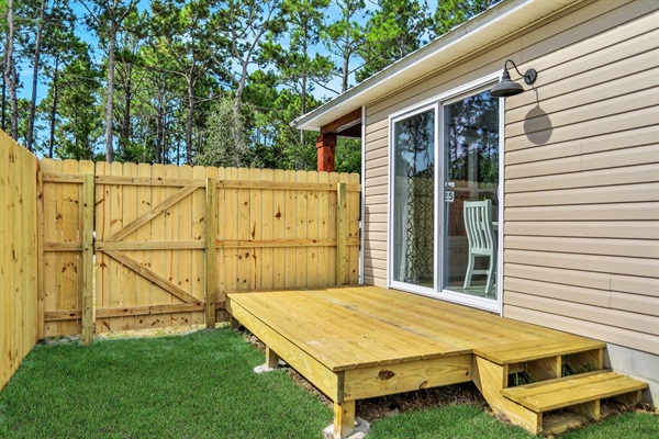 Fully fenced yard with the front fence gate right off of the sliding doors which are in the dining room.