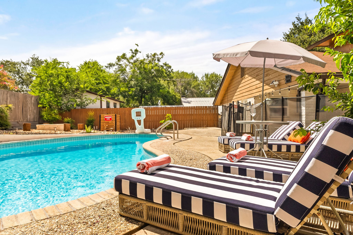 Stretch out and enjoy resort-style relaxation by the pool.