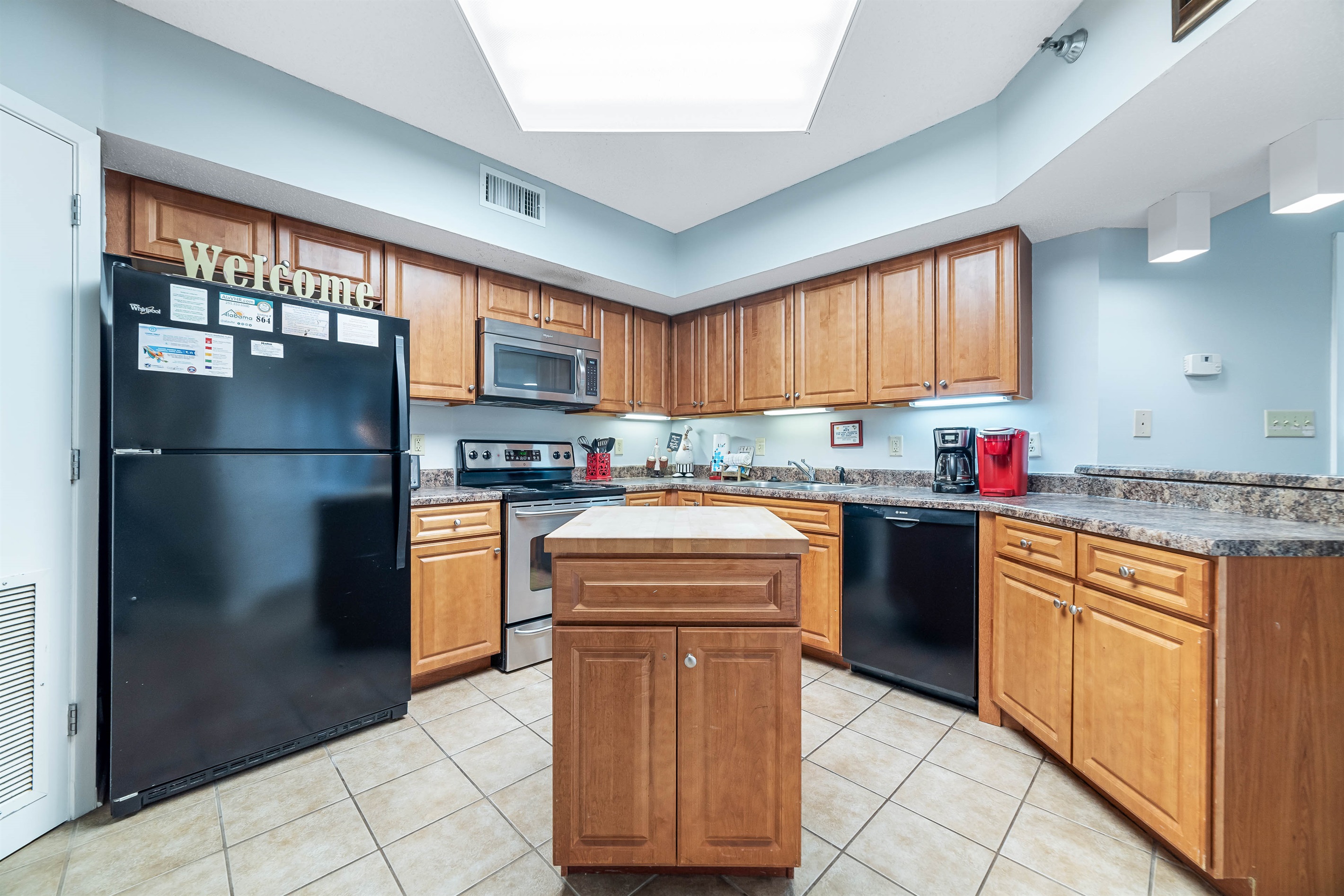A well-equipped kitchen featuring modern appliances and stylish finishes, perfect for culinary enthusiasts.