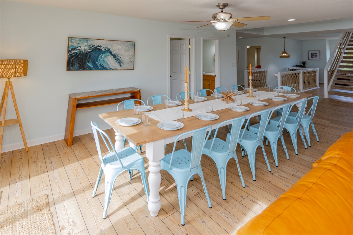 Two custom-made extra long wooden tables create two dining spaces in the main living area great room
