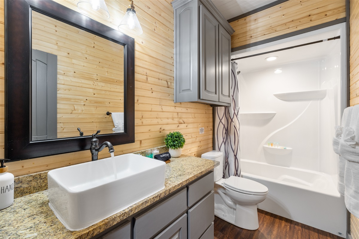 Bunk Room bath: Conveniently located bathroom for easy access from the room and game room