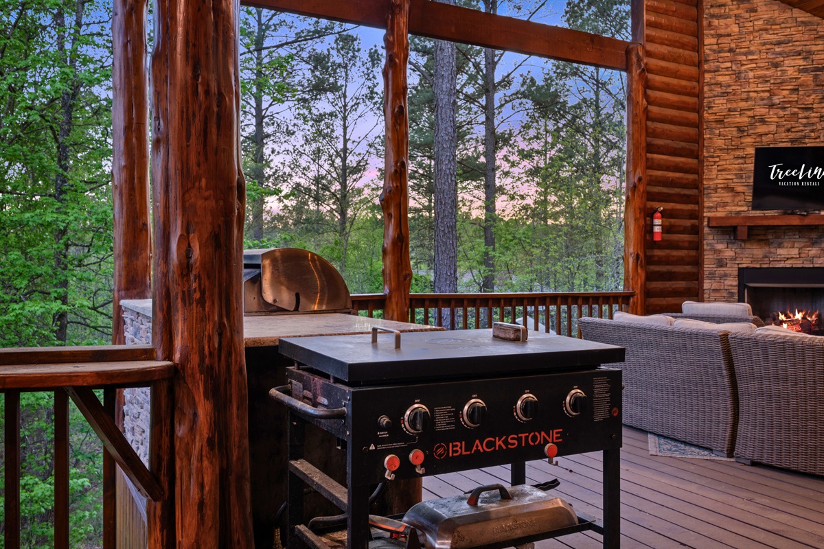 The outdoor grilling station makes it easy to prepare meals while enjoying the scenery, adding to the overall experience of cooking and dining outside.