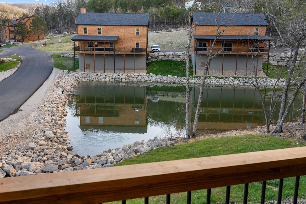 A peaceful view overlooking the water and nearby cabins.