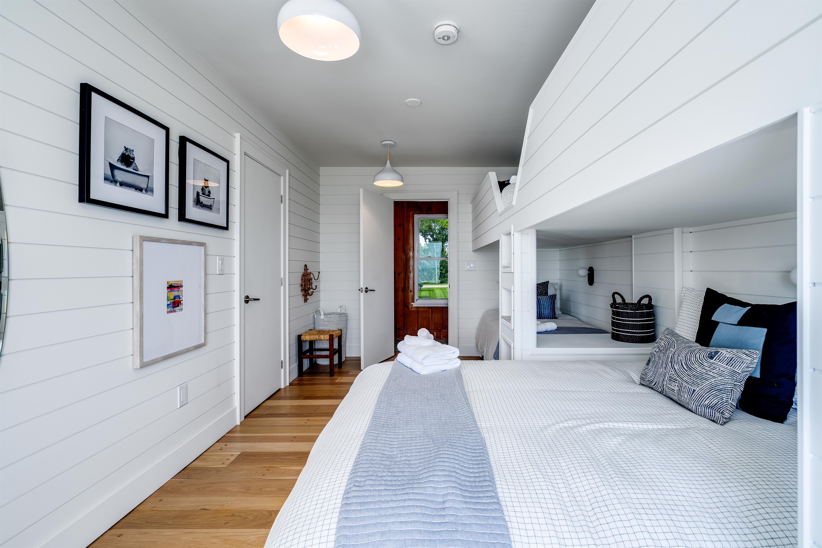 Bedroom with 3 twins, and 1 Queen bed. 