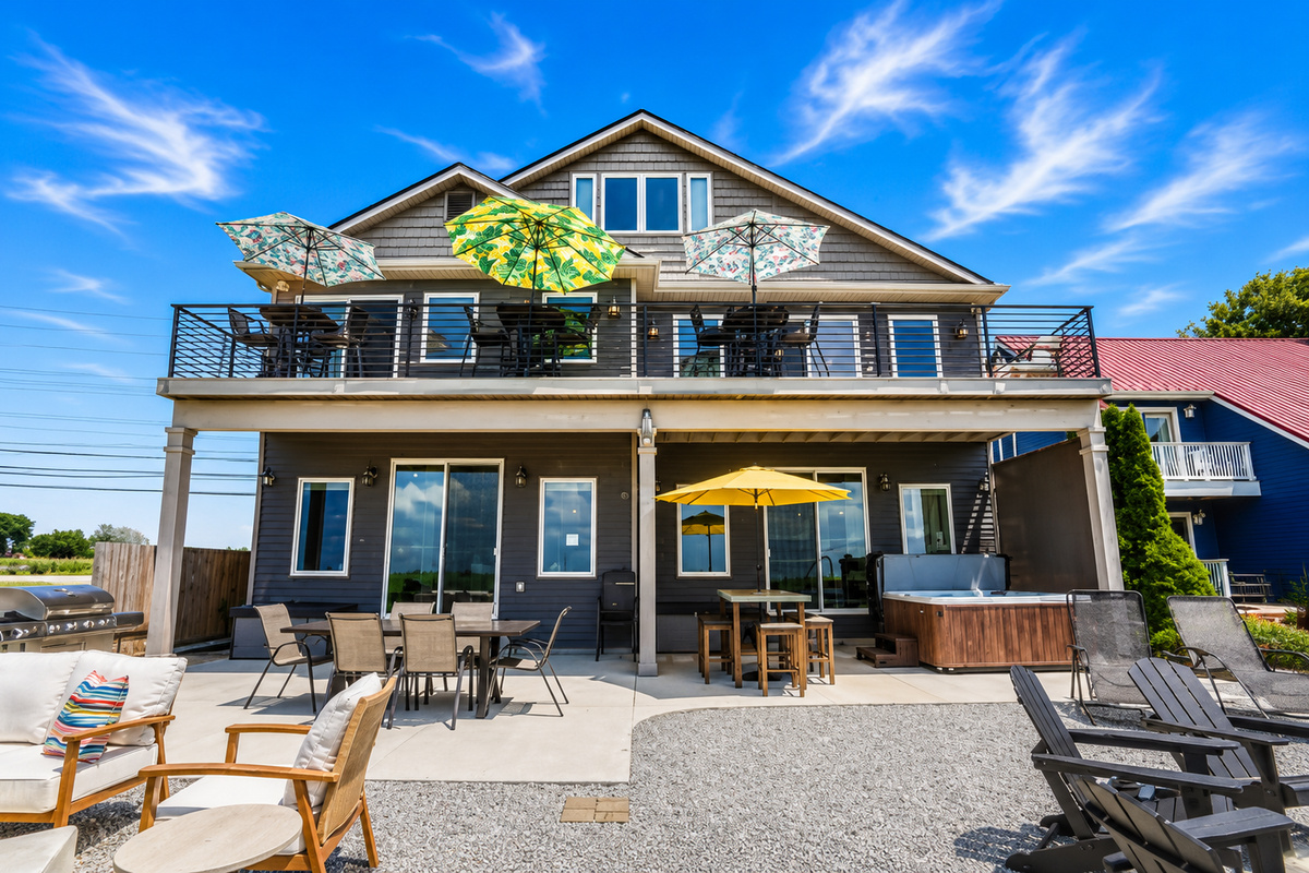 Welcome to your private waterfront backyard! With over 50 feet of canal frontage, a private dock, kayaks, a hot tub, fire table, outdoor dining, and plenty of space to relax, this is where unforgettable Lake St. Clair memories are made.