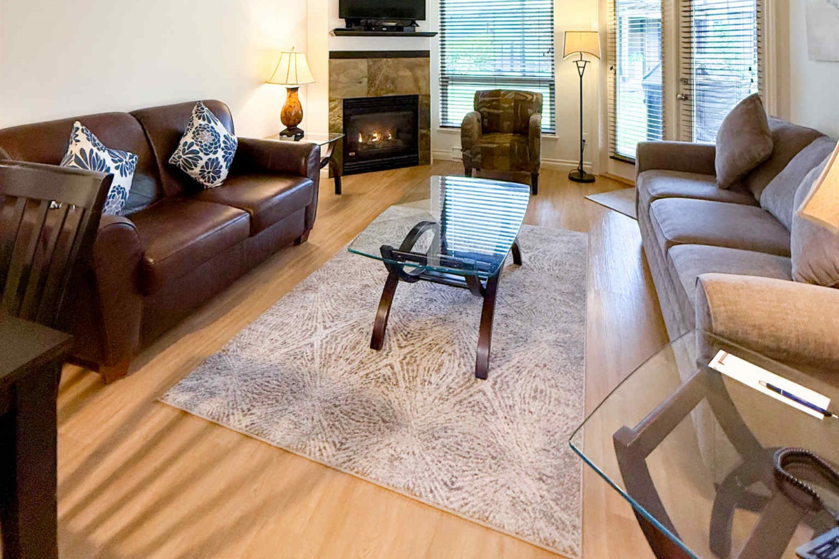 Unit A Living room area. Natural gas fireplace. Streaming TV. Double glass doors to private covered patio.