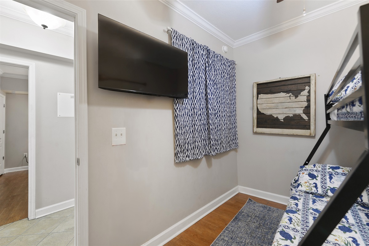 Bedroom 3. Twin over full bunk bed. Tv.
