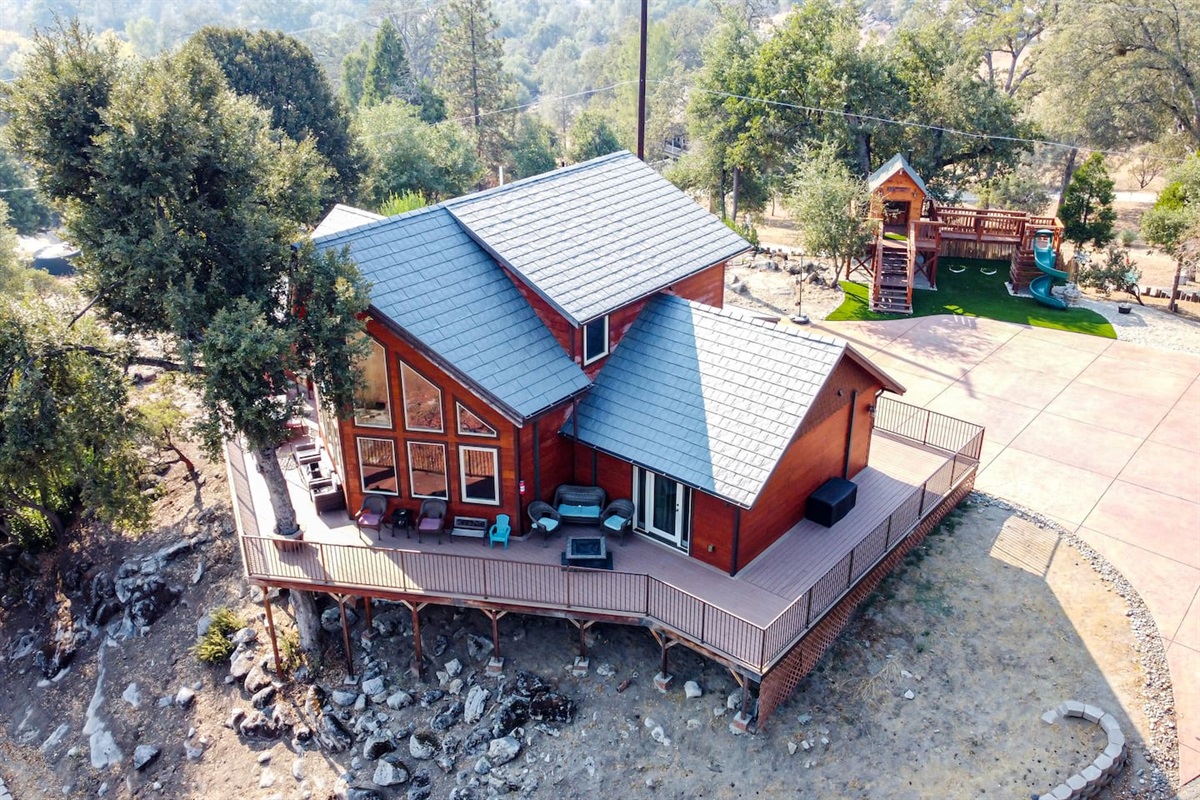 View of Waterfall Lodge, Playground and parking area in front of the house