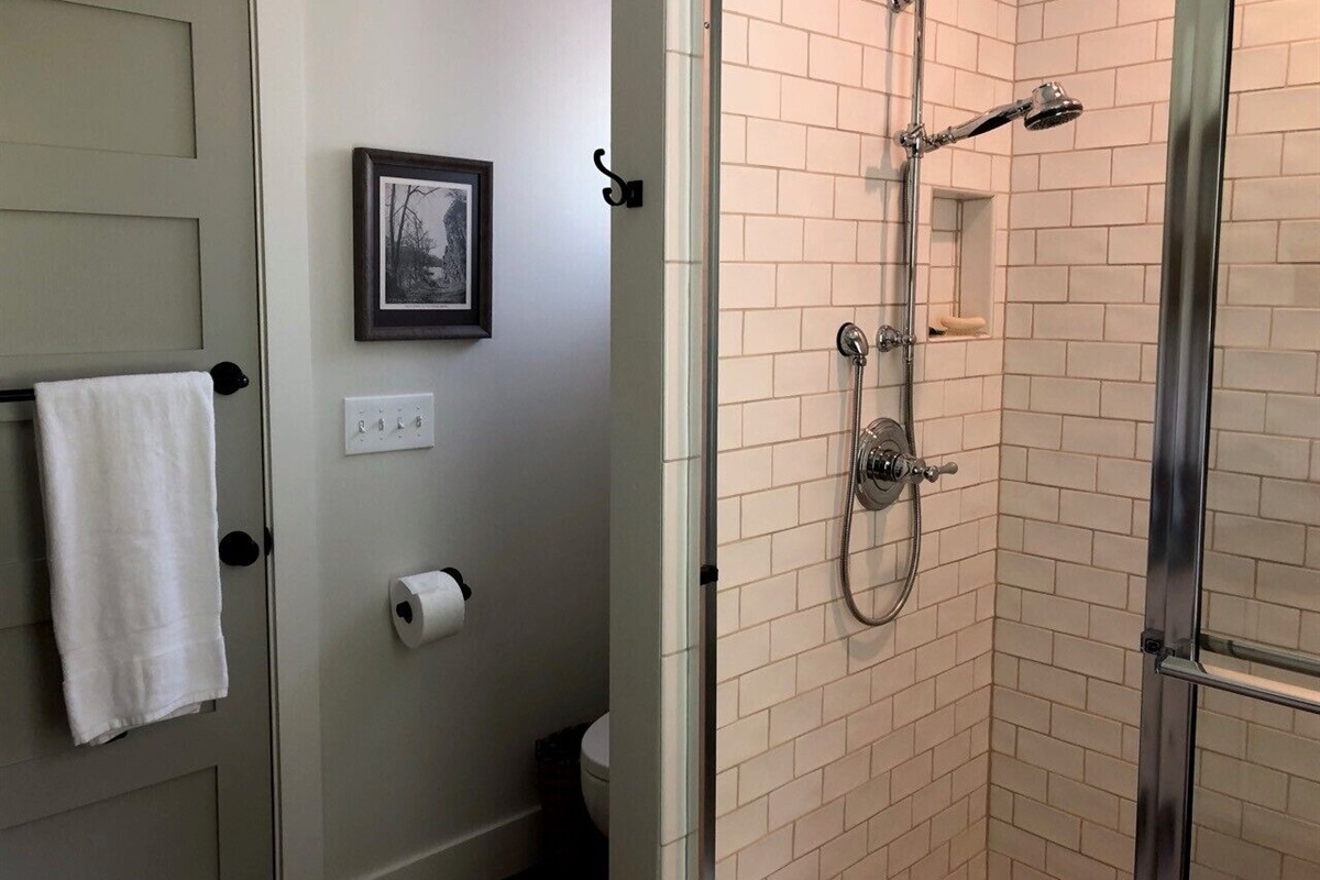 Upstairs en suite bathroom off of queen bedroom. Shower with adjustable head. 