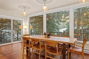 This primed for the perfect meal while the beauty of the forest pours in through the large picture windows.