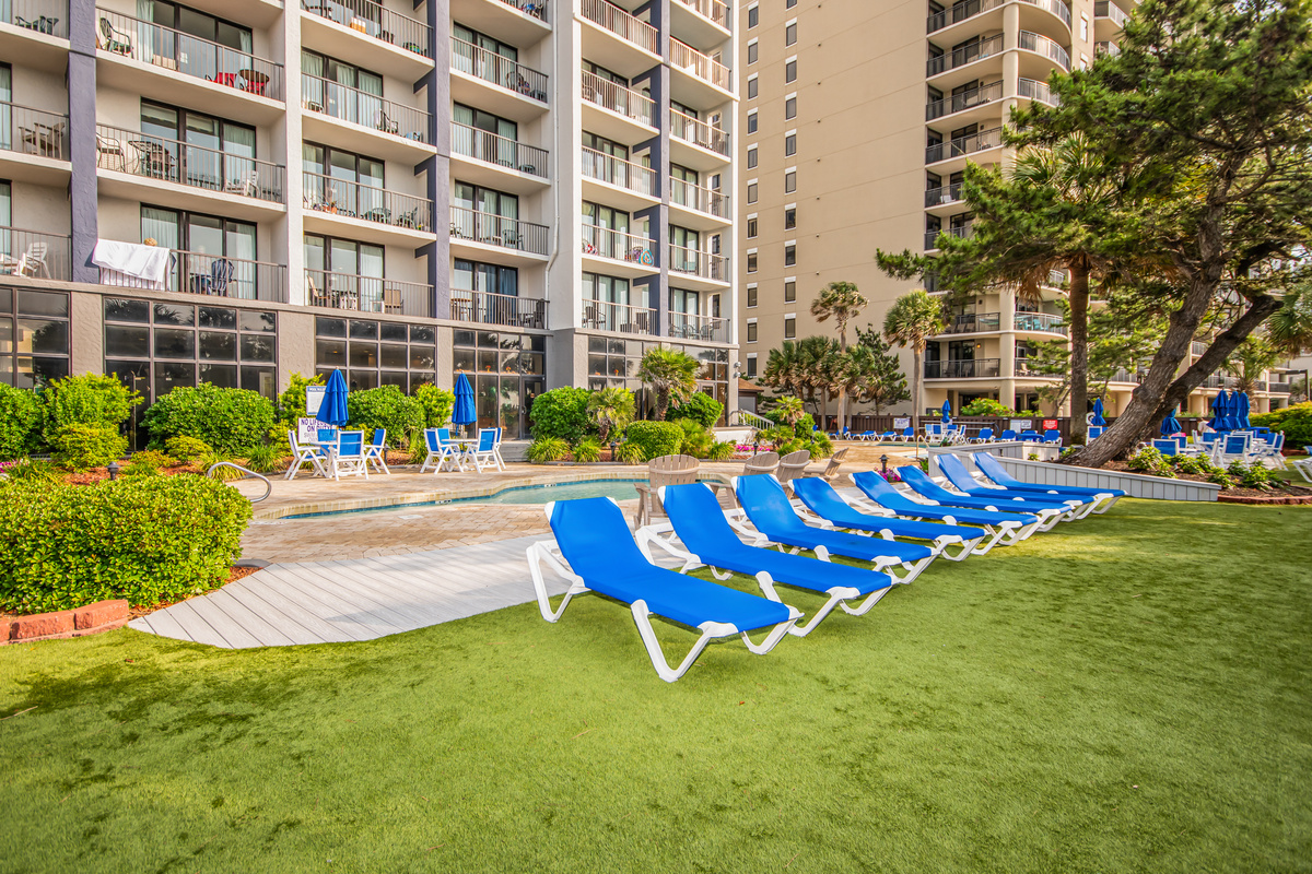 New comfortable lounge chairs, tables, and umbrellas available for all guests! 