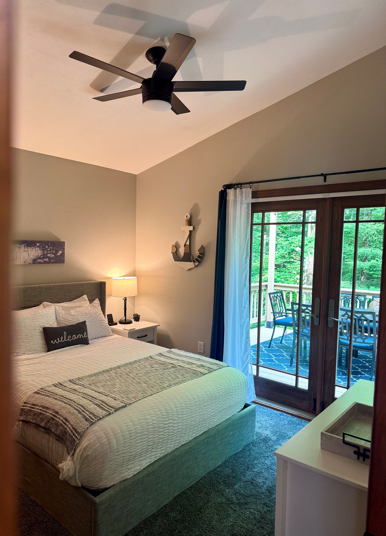 Queen bedroom with walkout French doors to access the back wrap around deck