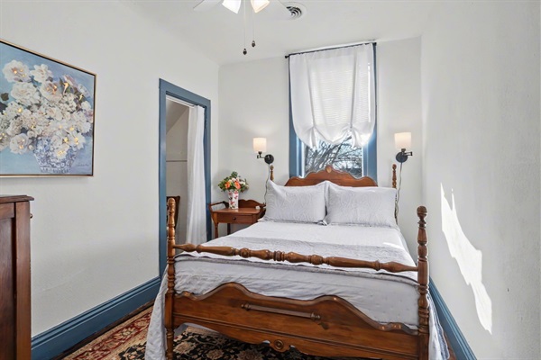 South bedroom with Full size bed and dresser with walk-in closet