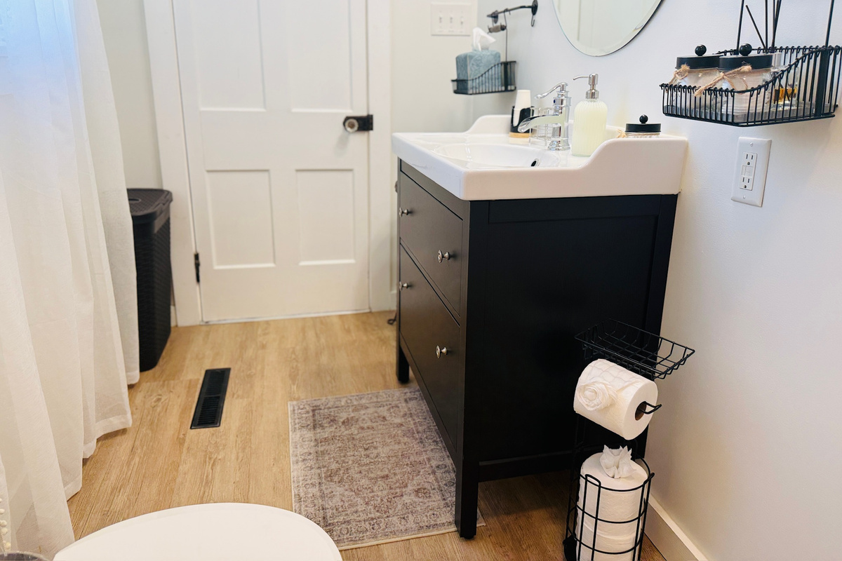Bright main-floor bathroom with a full tub and shower.