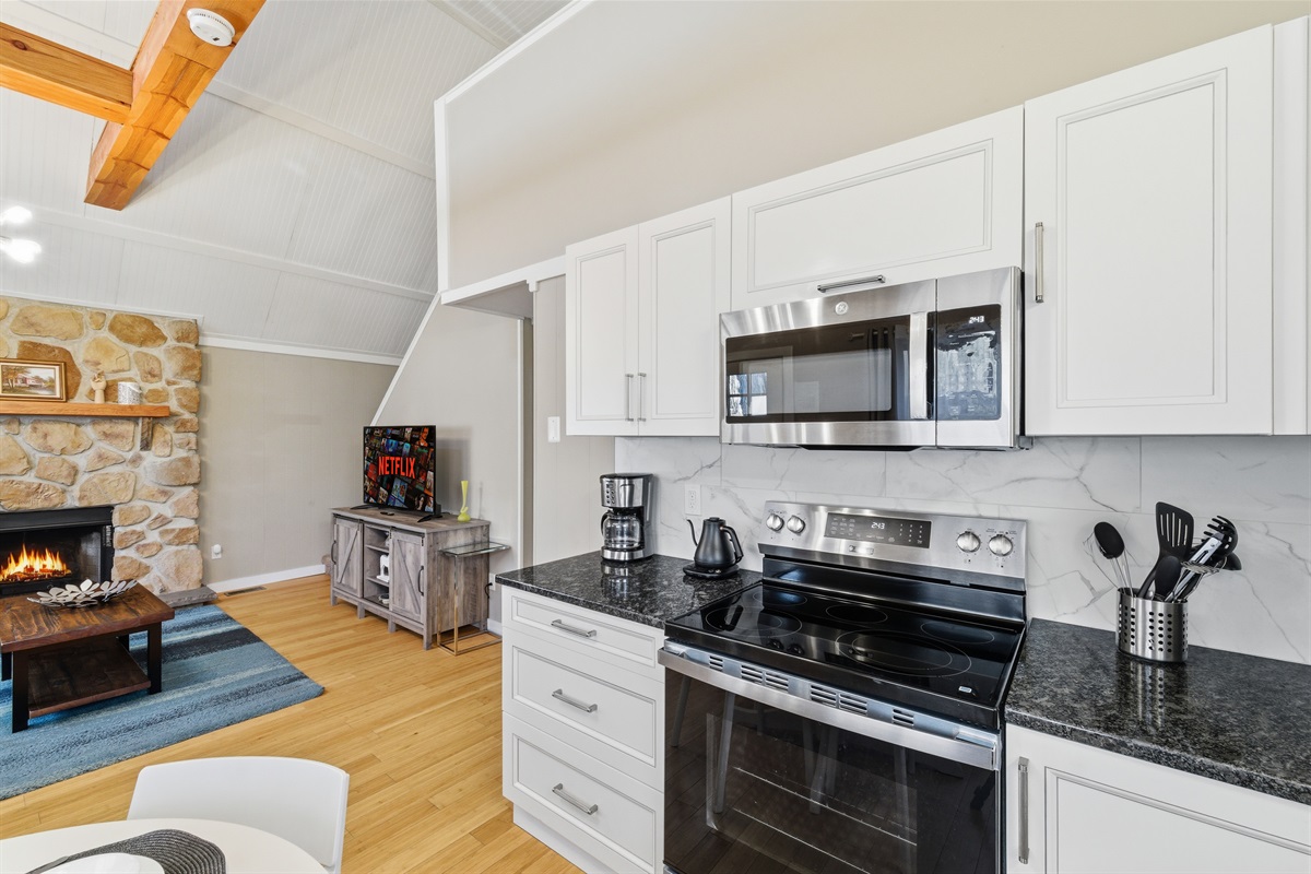 Kitchen with stainless steel appliances. Stove has built in air fryer