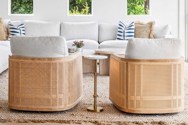Inviting seating and warm finishes offer the perfect spot to unwind after a sun-filled day by the water.