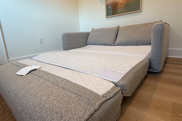 This versatile pull-out couch in the landing area provides an additional queen size sleeping option for flexible group stays. 