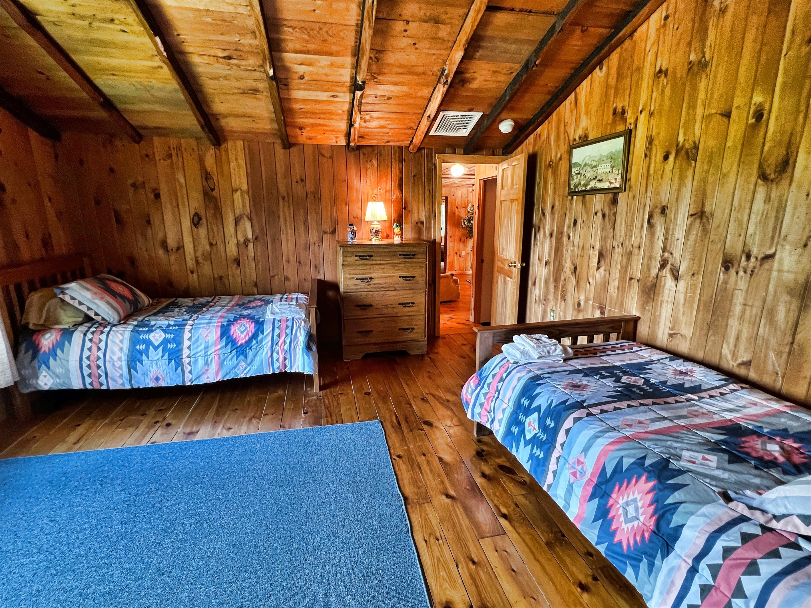 Bedroom #5 on 2nd floor w/ 2 twin beds. Full bathroom located just outside this bedroom for easy access.