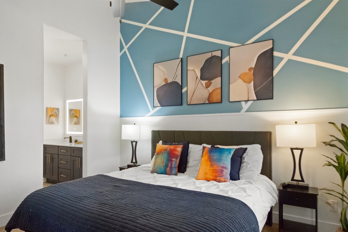 Sleep in comfort in this thoughtfully designed bedroom featuring a cozy, comfortable bed dressed in fresh linens and soft pillows for a restful night.