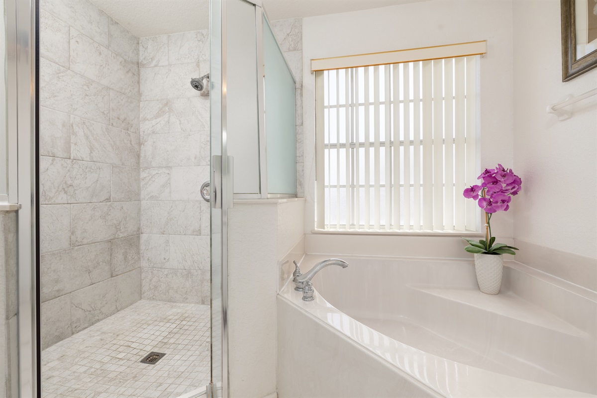 The master bath features a huge garden tub and a walk-in shower.