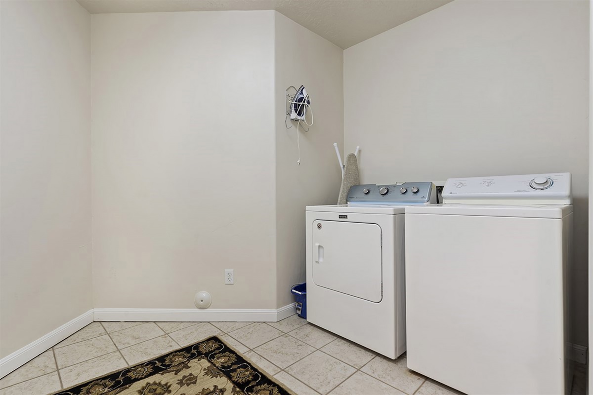 A dedicated laundry room with in-unit washer and dryer, making extended stays seamless and stress-free.