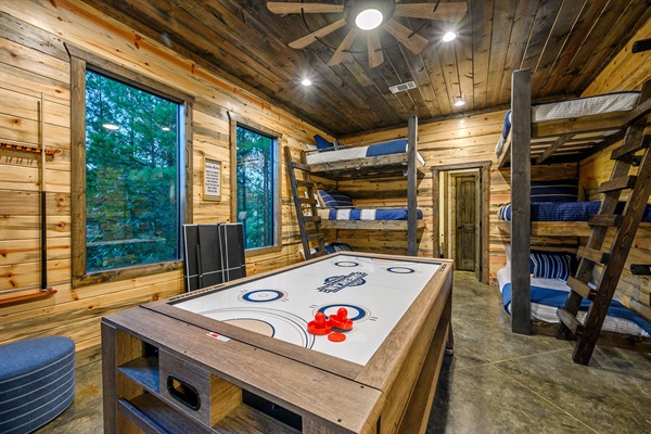 Luxury wood-clad retreat with built-in bunks and ultimate game-night vibes.