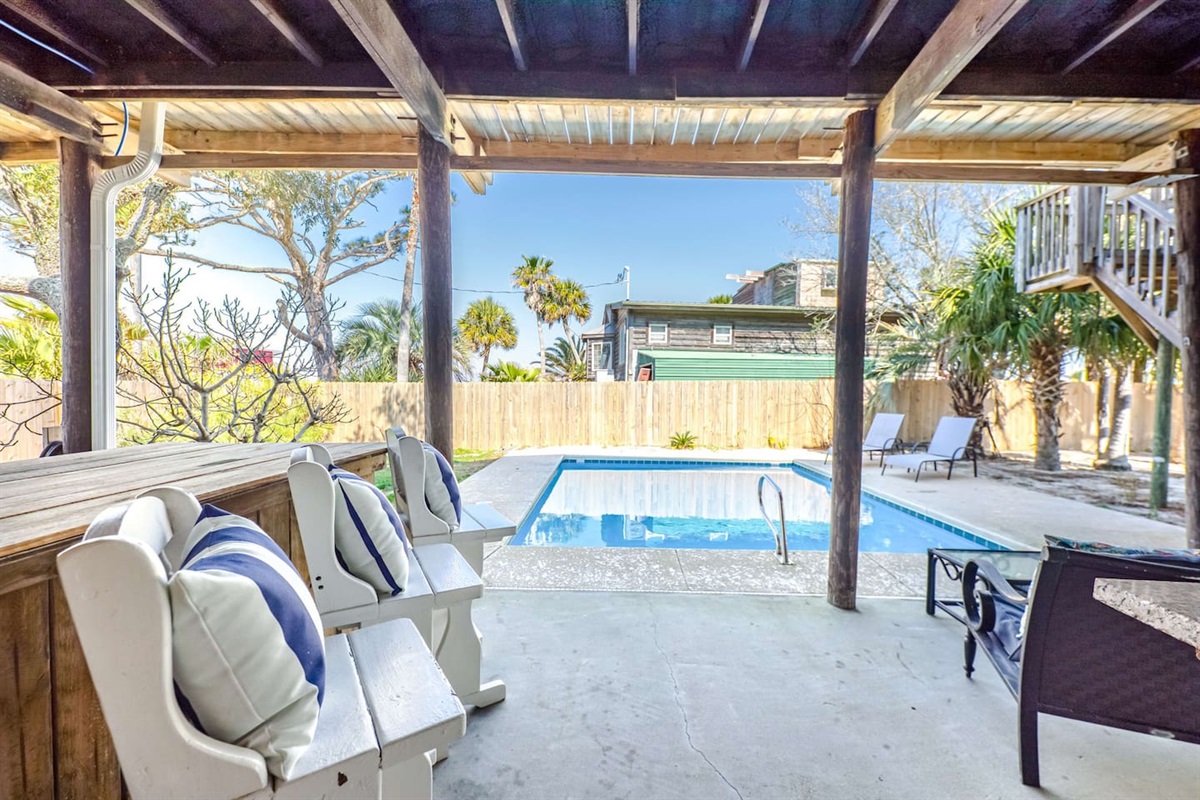 Outdoor Lounge: Relax by the pool with a drink in hand and soak up the Gulf Shores sun!