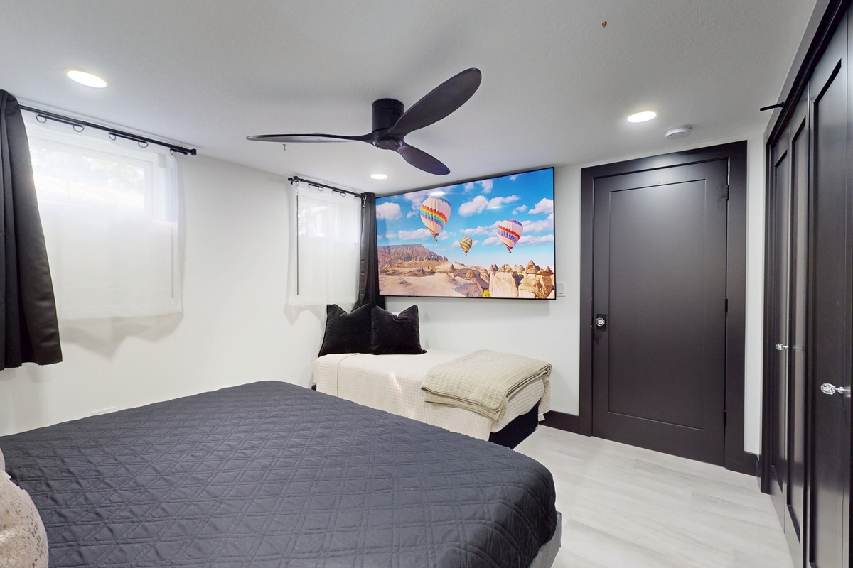 Second Primary Suite with King bed and twin bed.