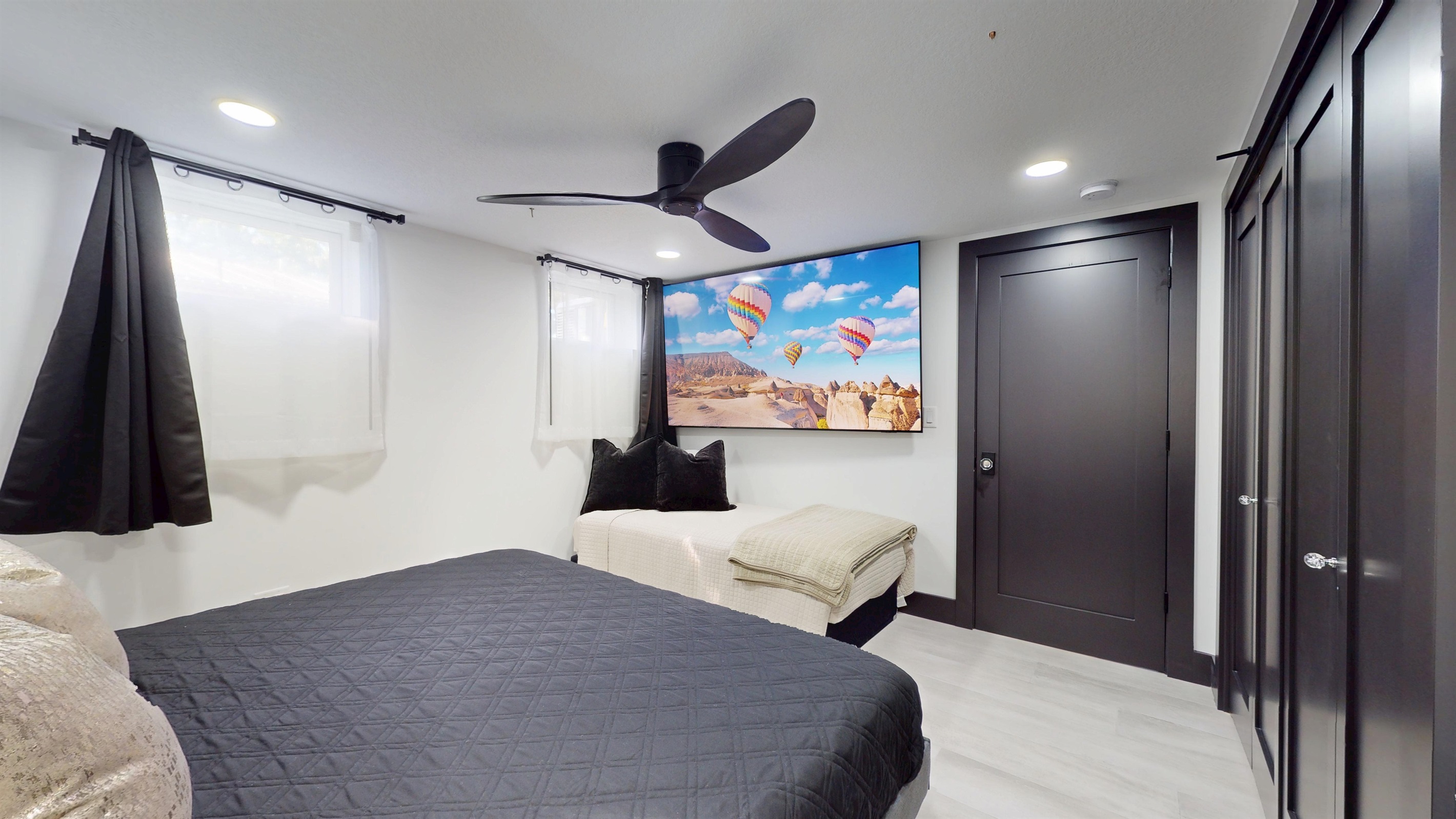 Second Primary Suite with King bed and twin bed.