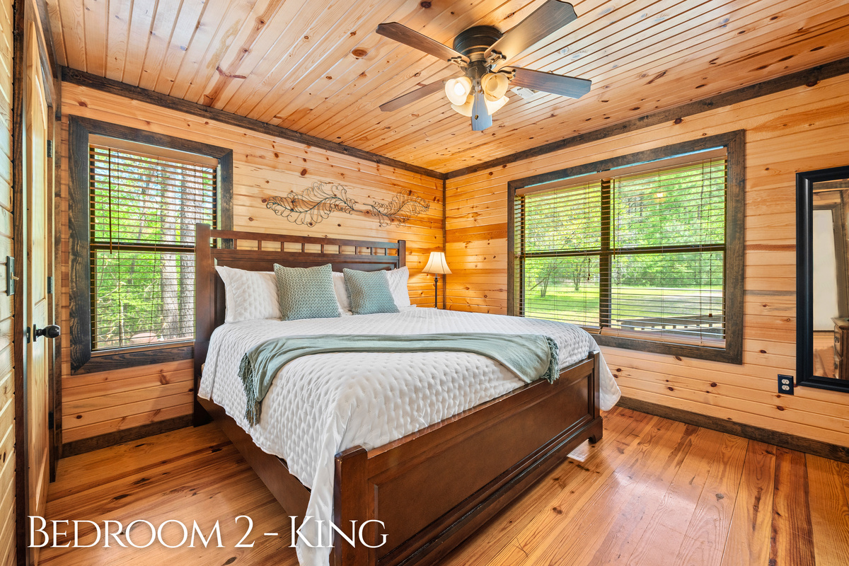 Bedroom 2 welcomes you with another king-size bed and gorgeous light filtering in through the trees.