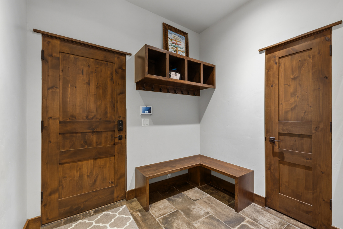 Large garage entry foyer for boot and coat storage