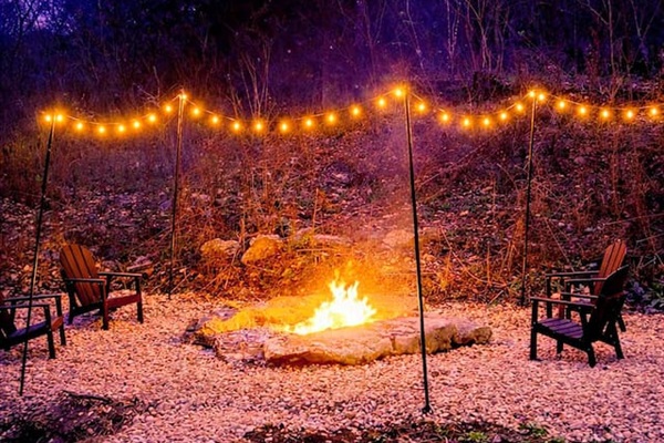 Outdoor Fire Pit: Gather around the flickering flames under a starlit sky and string lights!