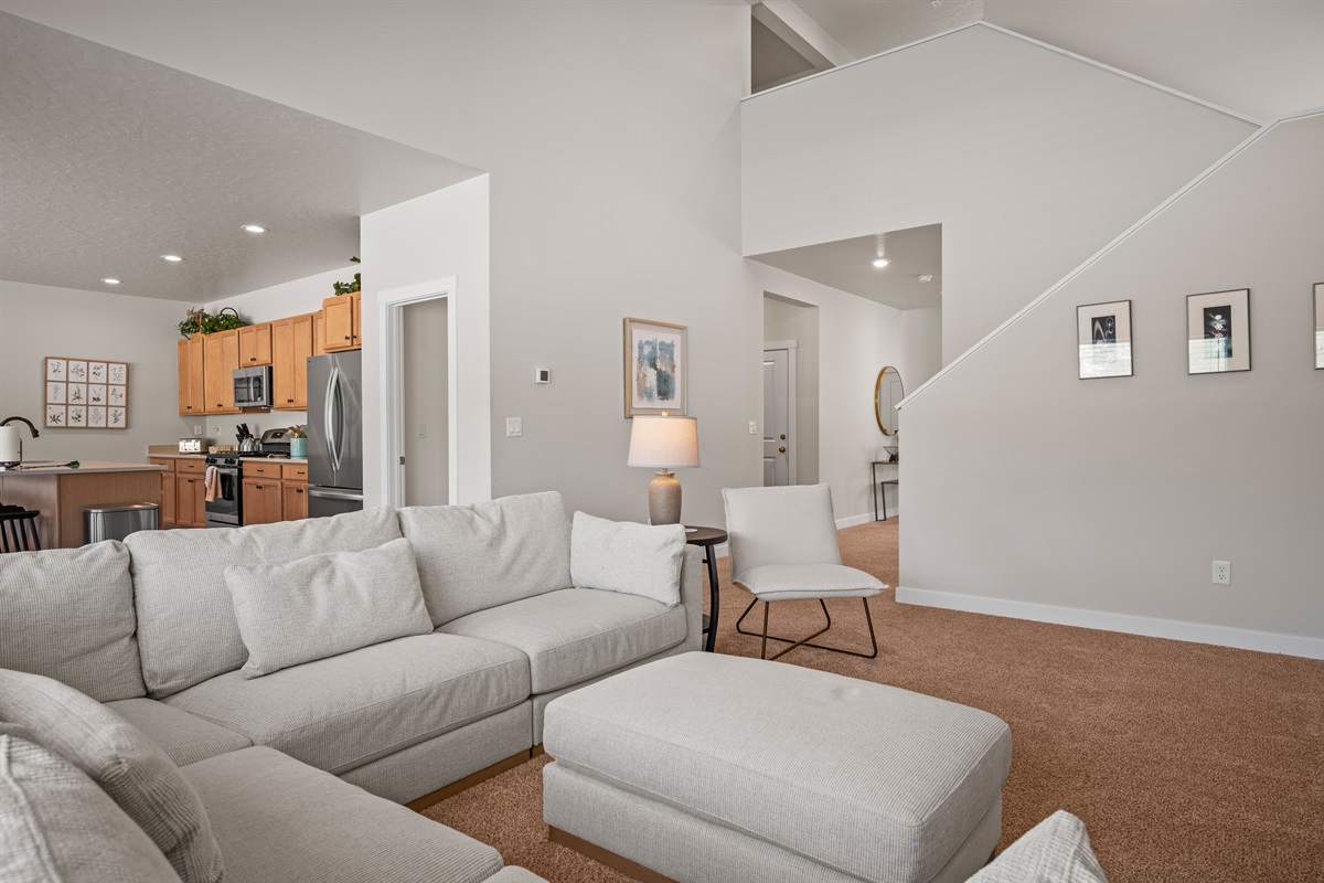 Rest easy upstairs with four inviting bedrooms, three well-appointed bathrooms, and a convenient laundry room for longer stays.