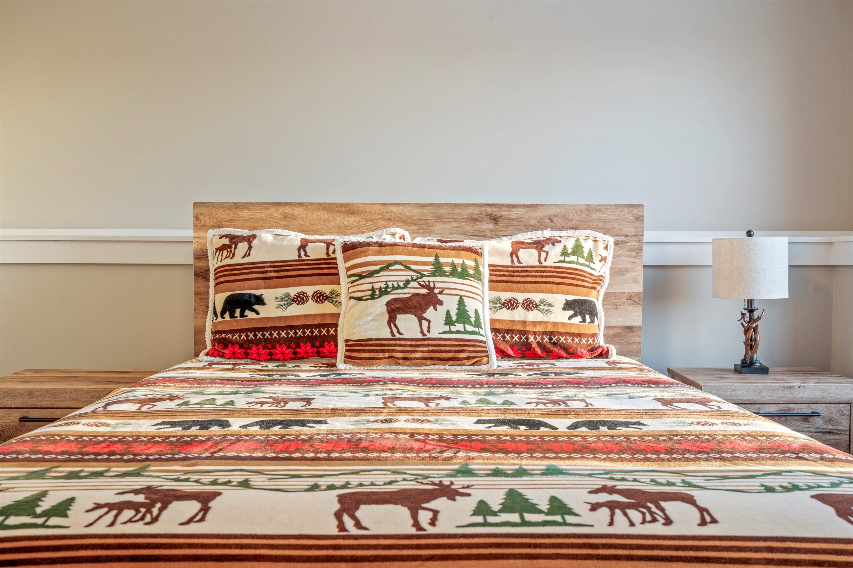 Relax in the basement bedroom with a cozy queen bed and added privacy.